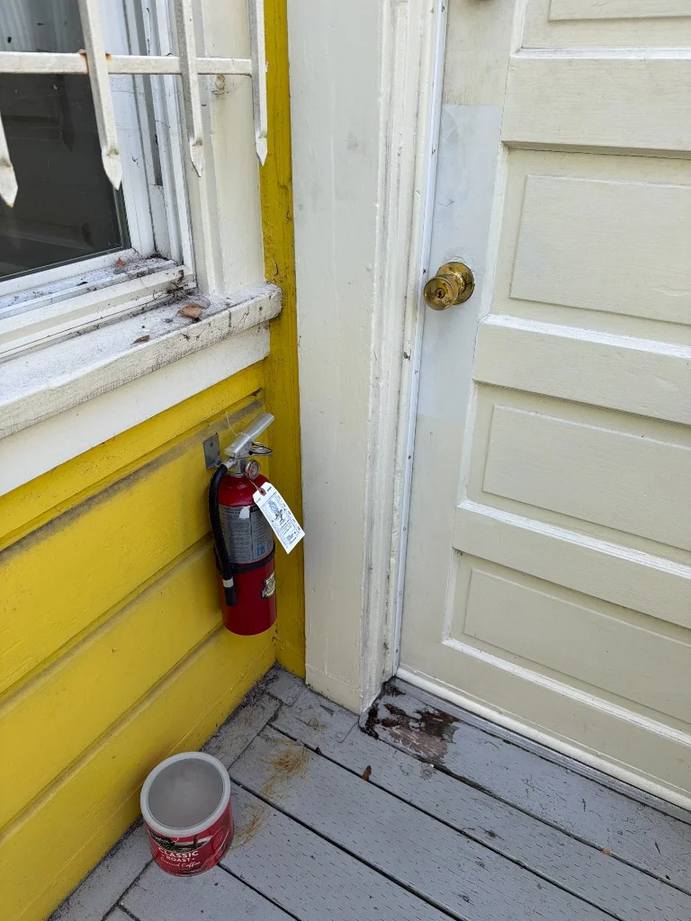 Official California State Fire Marshal annual inspection tag EE 26905 stamped Aug 2026 at 1034 Natoma St by International Fire Inc.