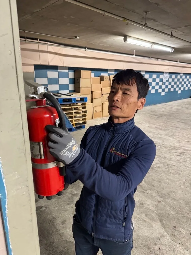 Fire safety technician inspecting facilities for Retail Stores & Shopping Centers